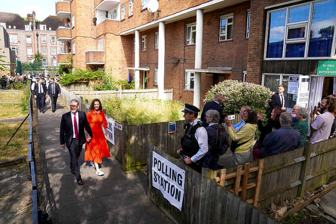 UK’s Labour set to sweep into power with huge majority, exit poll shows